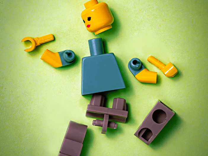 lego person broken into pieces