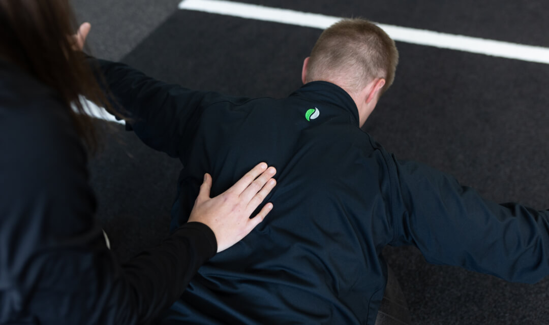 A physical therapist treating a back