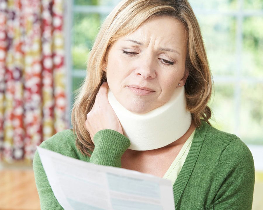 lady wearing a neck brace after an accident