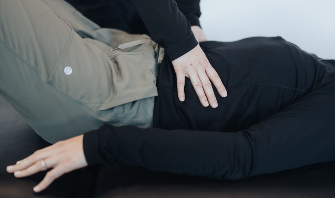 pro-therapy-pelvic-health-treatment A physical therapist treating a back