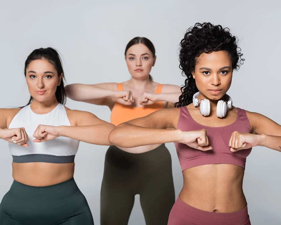 3 ladies doing a fitness routine