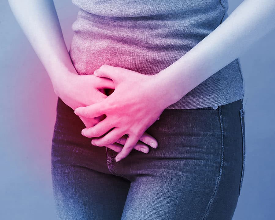 woman feeling pain from pelvic organ prolapse on a blue background