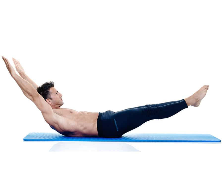 one caucasian man exercising fitness pilates exercices isolated on white background