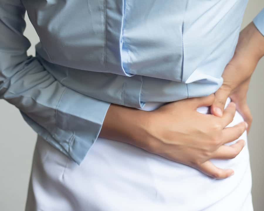 injured woman suffering from pelvis pain or hip joint injury; concept of pelvic joint pain, hip joint dislocation, rheumatoid arthritis injured woman suffering from pelvis pain or hip joint injury; concept of pelvic joint pain, pelvic floor problems